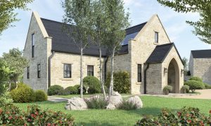 Luxury modern stone cottage with pitched slate roof and arched entrance, surrounded by landscaped garden, featured in Architecture Vogue magazine