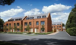 Contemporary red brick townhouses in Hertfordshire by iB Architects, featuring pitched roofs, large windows and sustainable family home design.