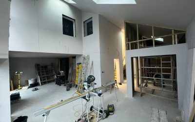 Interior construction space with exposed framing, tools and skylight featured in Architecture Magazine.