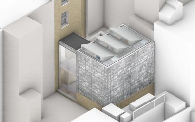 Modern urban infill extension with textured stone façade and skylight roof, featured in Architecture Magazine