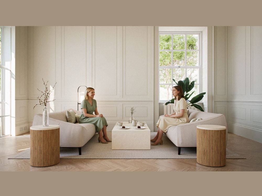 2 people talking in living room as featured in the built environment network