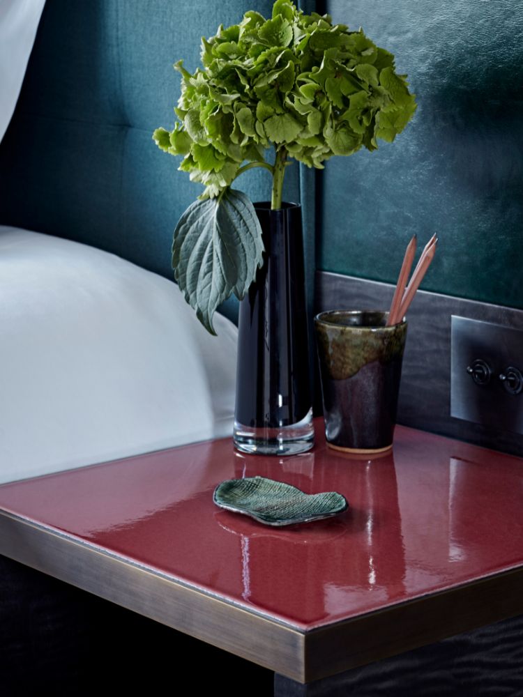 bedside table image with flowers by the built environment network